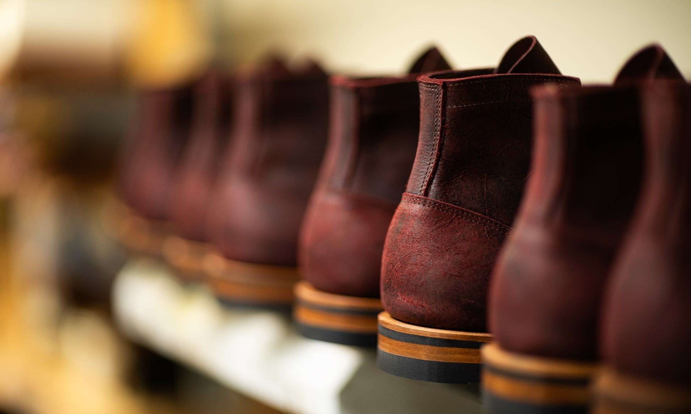 finishing rack filled with burgundy rambler boots