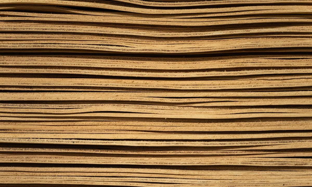 stack of vegetable tanned leather hides