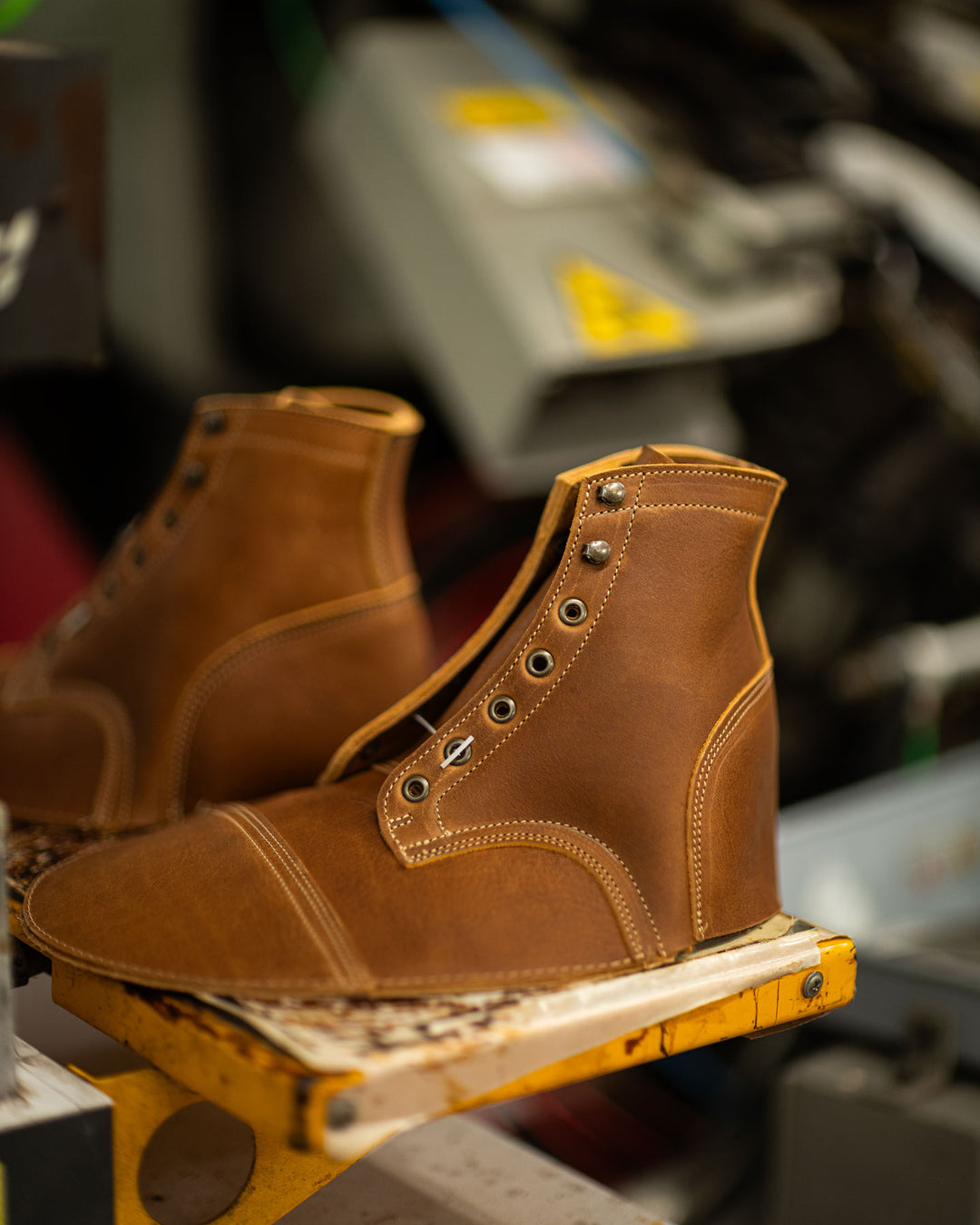british tan grizzly uppers waiting to be lasted sitting near machinery