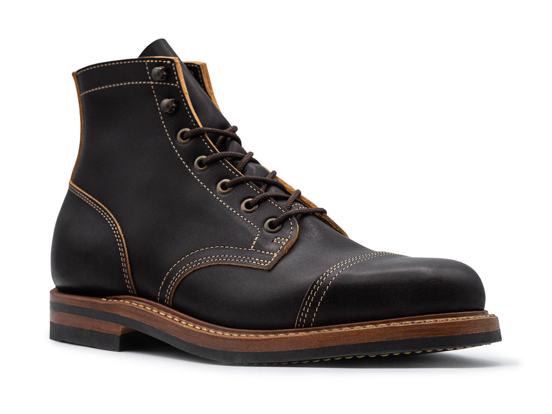3QTR view of black leather boot on white background