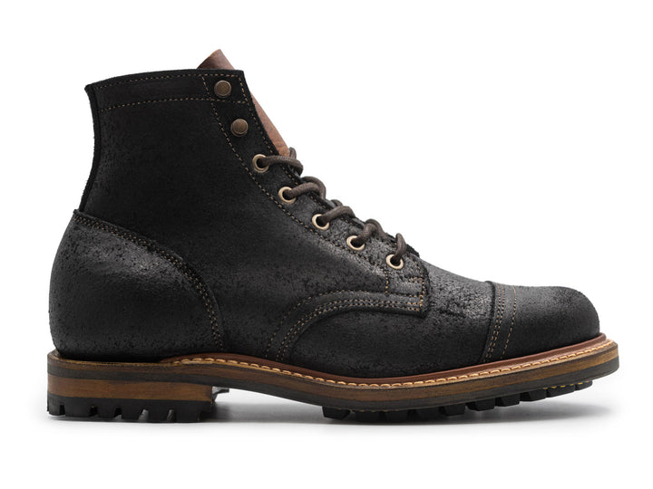 black rough out leather boot on white background