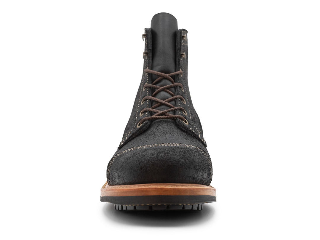 black leather boot on a white background front view