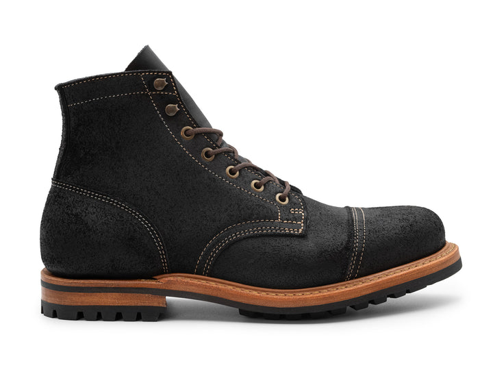black leather boot on a white background side view