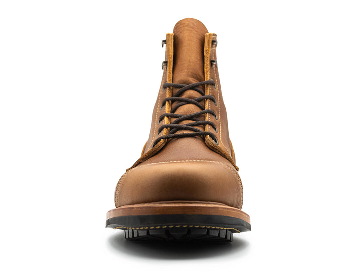 front view of tan brown leather cap toe boot on white background