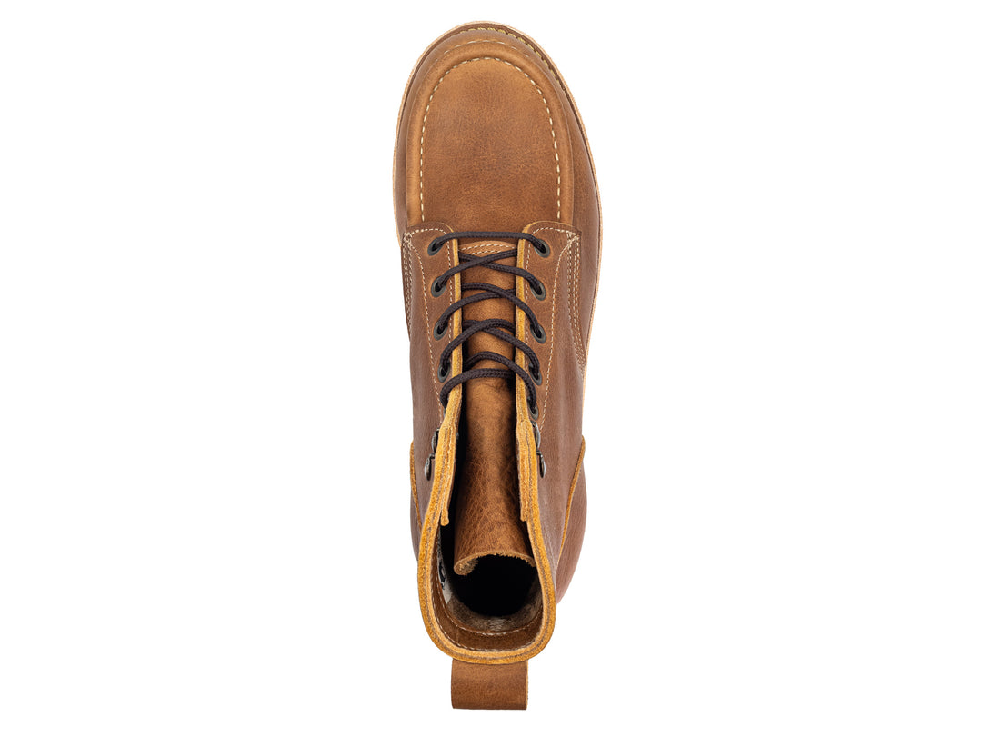 topdown view of light brown leather moc toe boot on white background