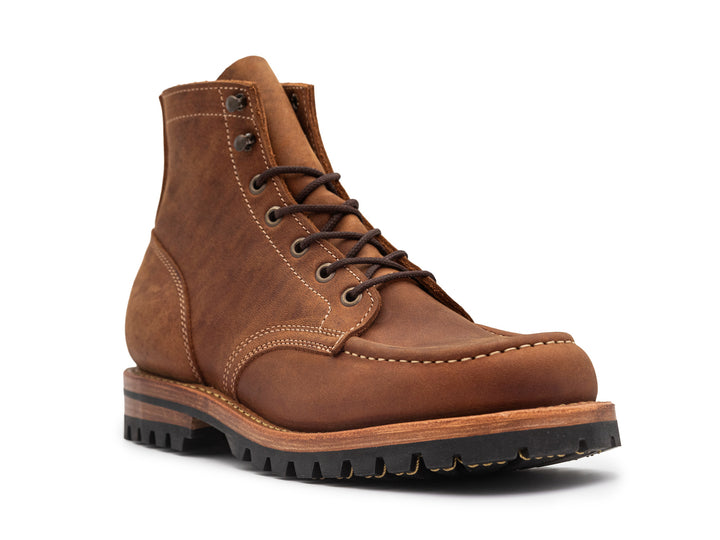 3qtr view of brown leather moc toe boot on white background