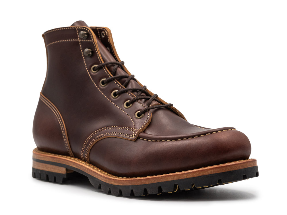 brown leather moc toe boot three-quarter profile on white background