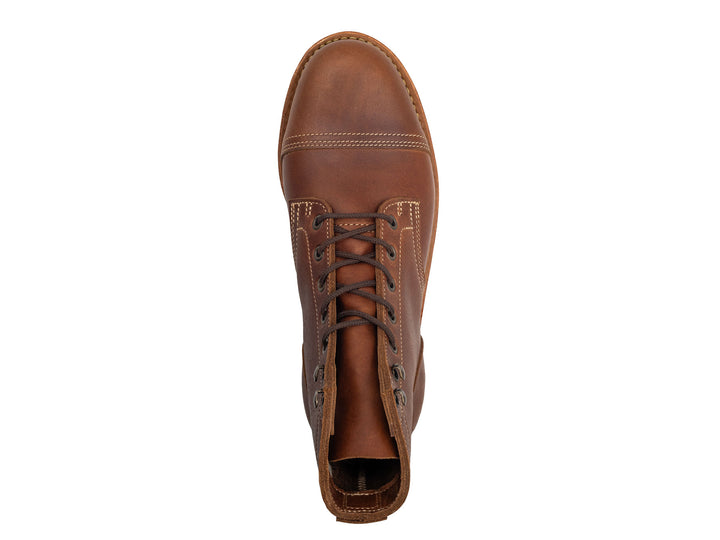 Brown leather boot on a white background topdown view