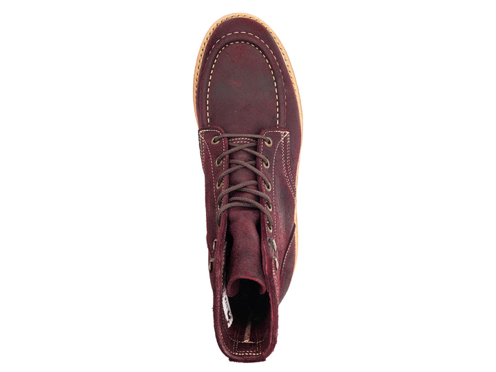 topdown view of burgundy rambler leather moc toe boot on white background