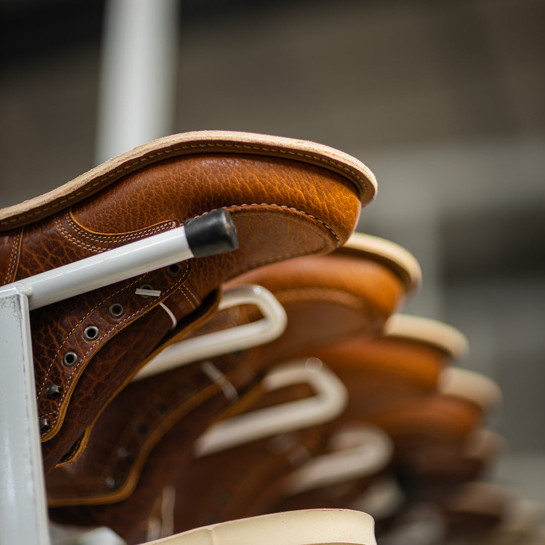 cognac shrunken bison moc toe boots in production upside down before outsole attachment