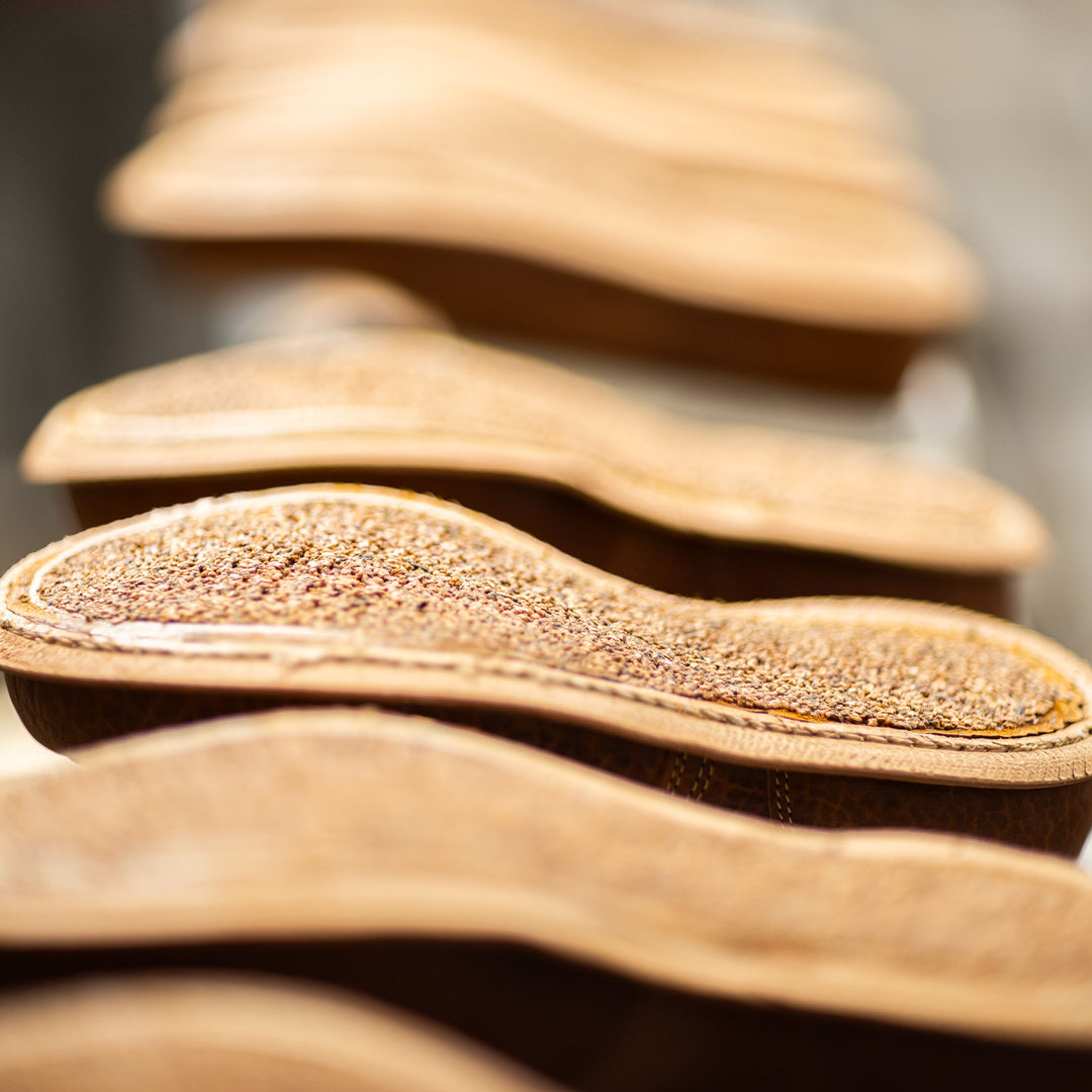 cognac shrunken bison moc toe boots in production with cork filling