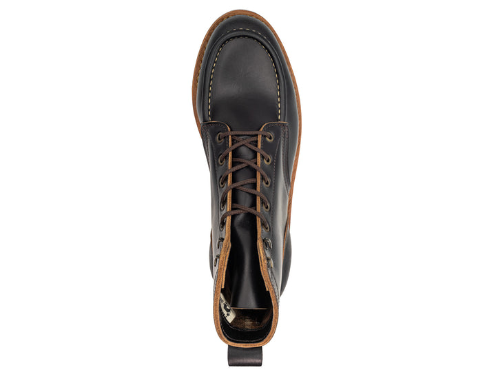 topdown view of black moc toe boot on white background
