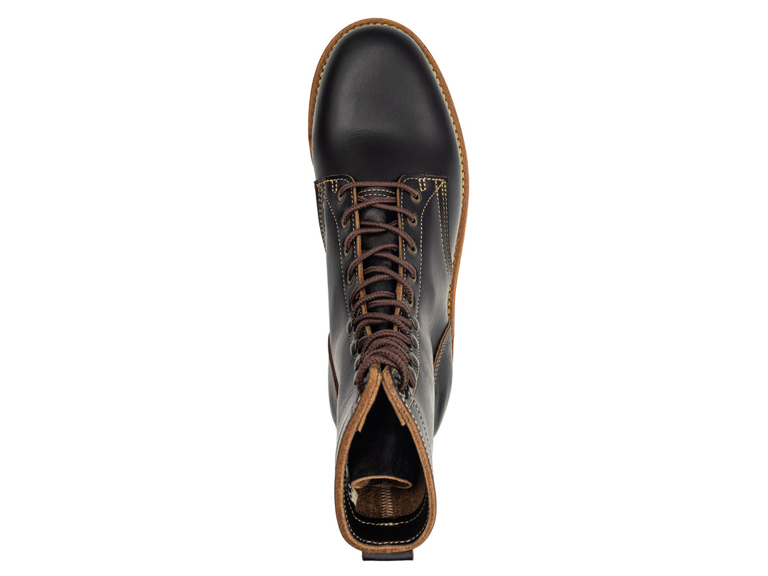 topdown view of tall black leather boot on white background