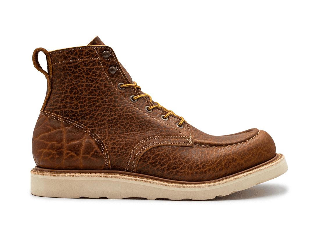 animation showing leather variation on side view of cognac shrunken bison moc toe boot on white background