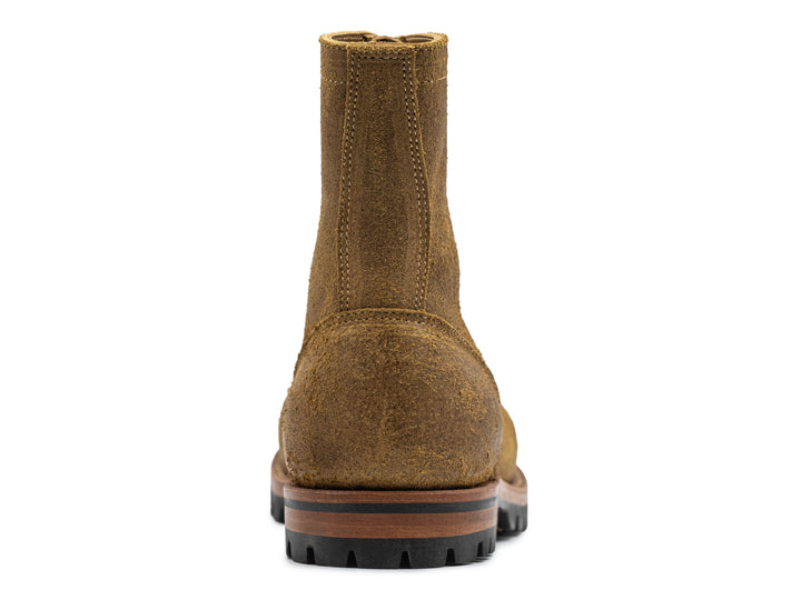 back view of coyote oiled rough out leather boot on white background