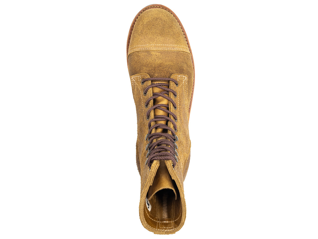 topdown view of coyote oiled rough out leather boot on white background