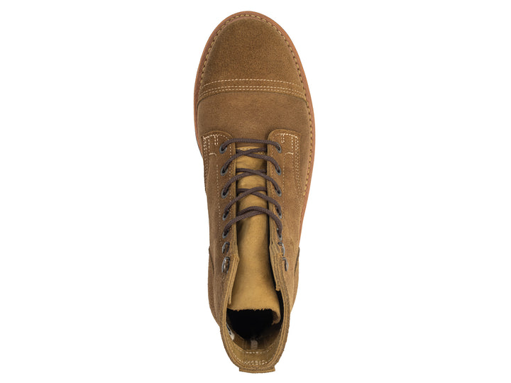 dark tan colored leather boot topdown view on white background