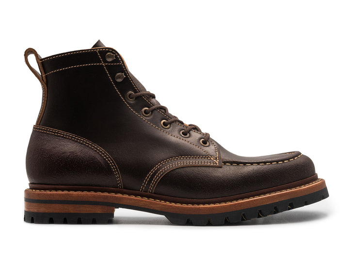 side view of java waxed flesh moc toe on white background