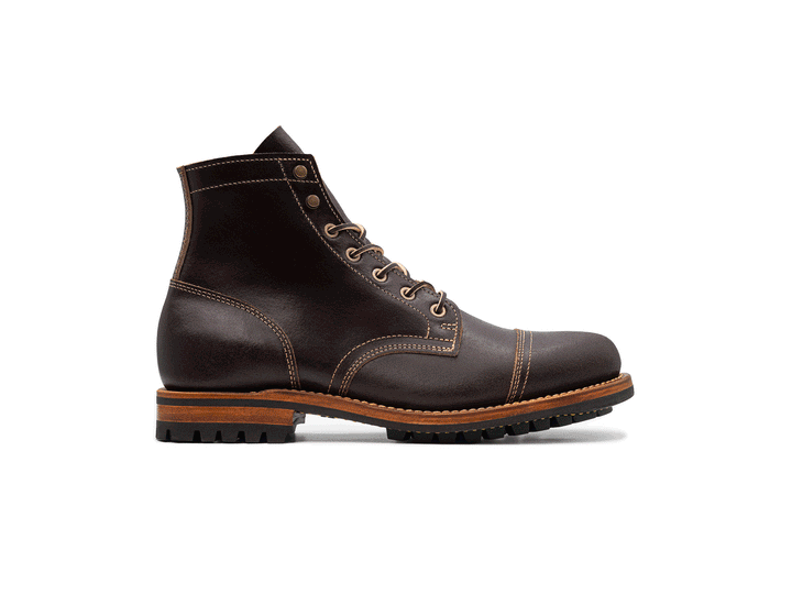 rotating brown leather boot on white background