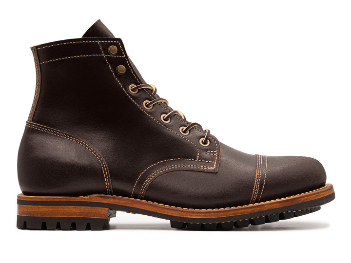 brown leather boot against white background