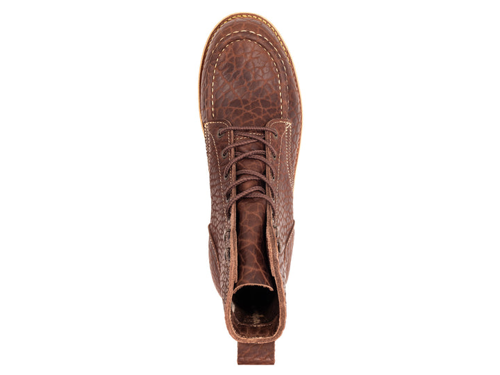 topdown view of brown textured leather boot with wedge sole on white background