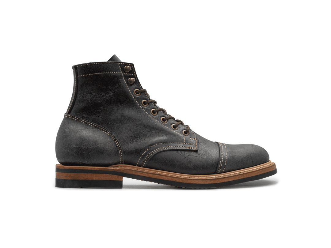 rotating 360° view of gray textured leather boot on white background