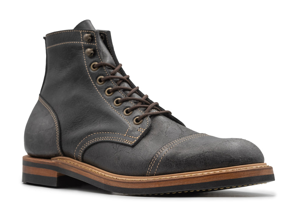 3QTR view of gray textured leather boot on white background