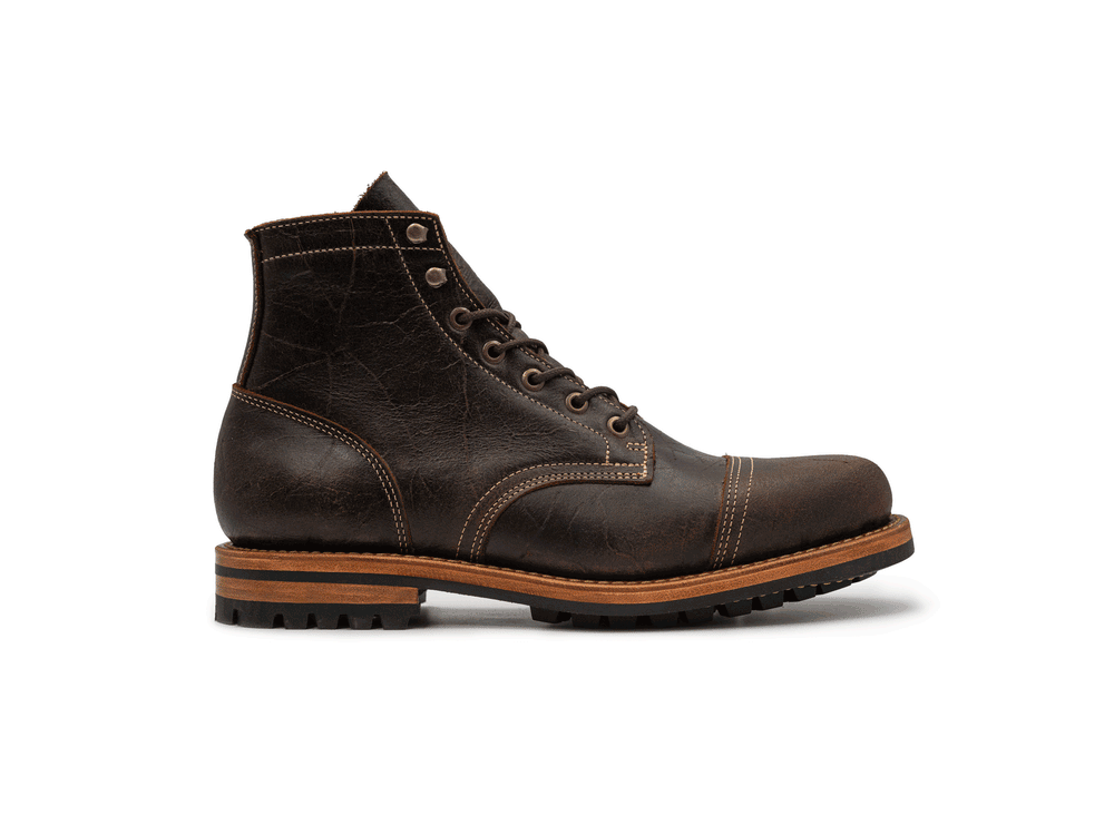 animated rotating 360° view of brown textured leather boot on white background