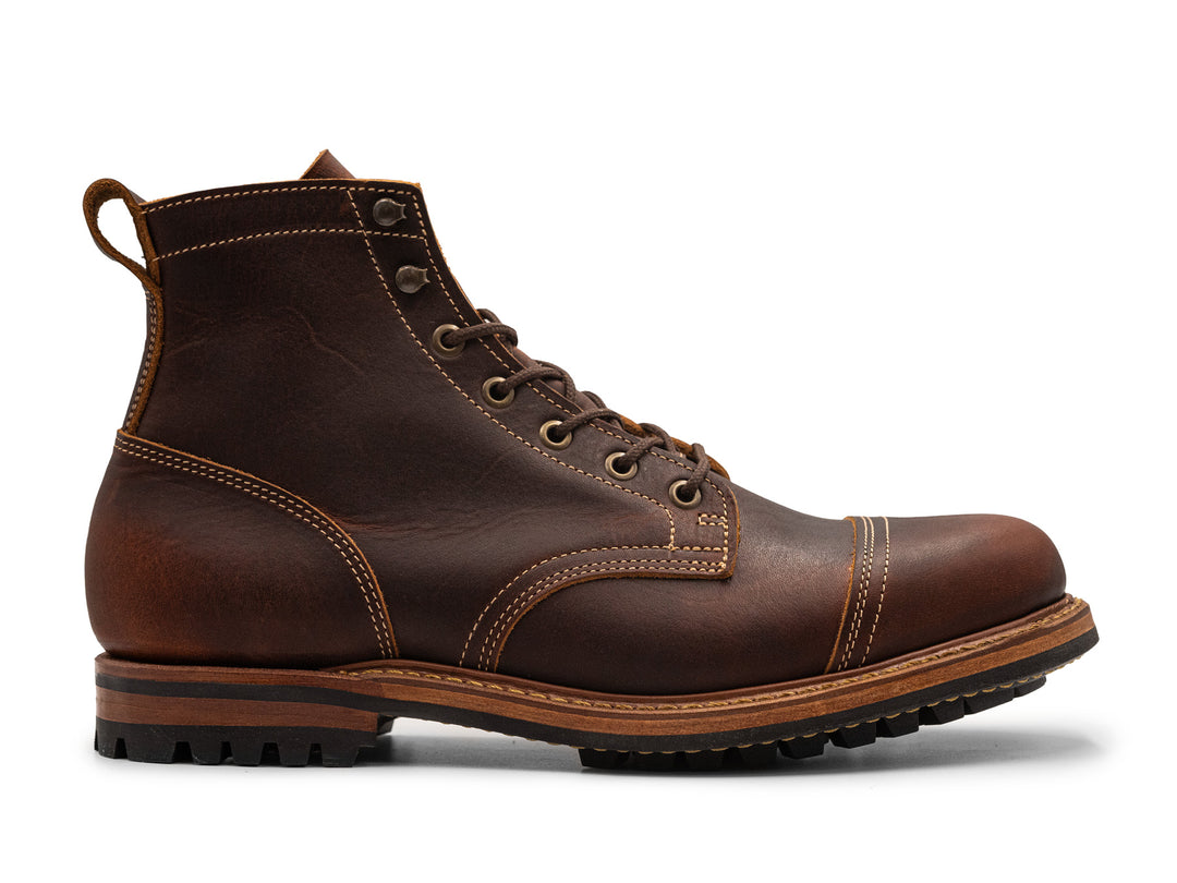 auburn brown leather boot on a white background side view