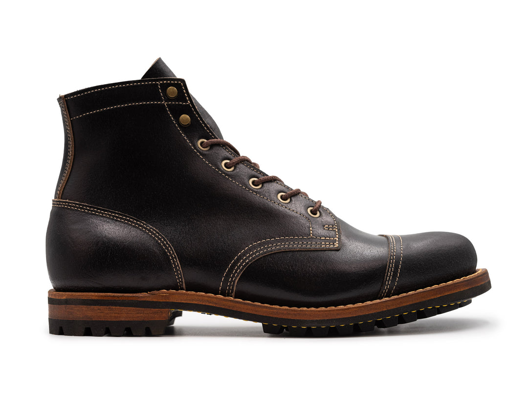 black leather boot on white background
