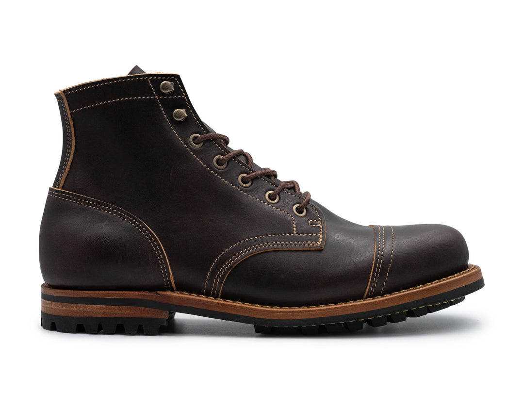black leather boot on white background