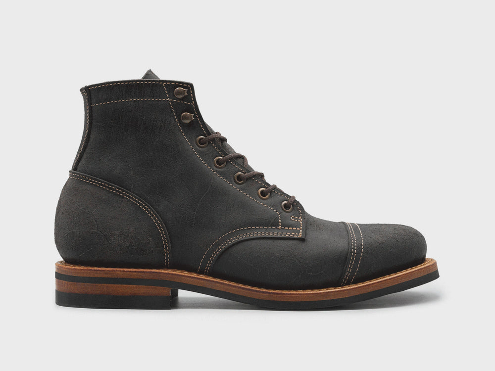animation flipping through different colored textured leather boots on white background